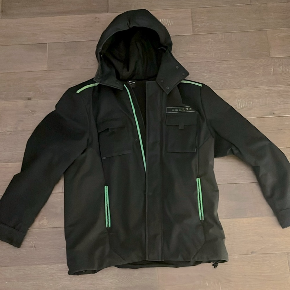 Oakley black and neon green snowboarding jacket. Men’s Medium.